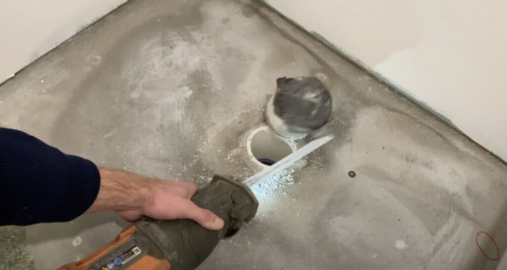 Cut the Basement toilet drain pipe flush with the basement floor 